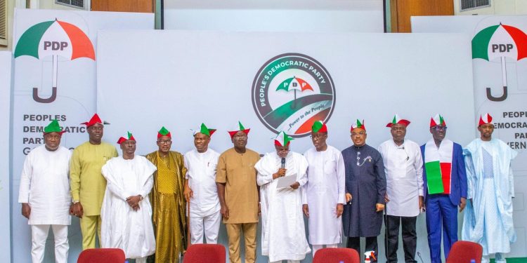 Buhari Swears in new INEC Commissioners