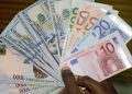 Naira slumps to N595/dollar
