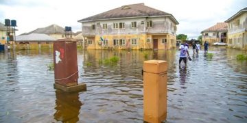 Buhari Blames the Recent Flooding on Building on Water Channels